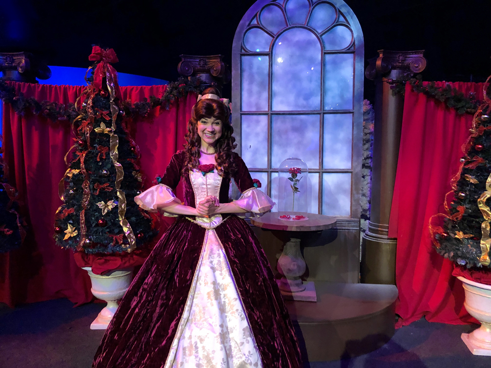 Women in a red velvet holiday ballgown